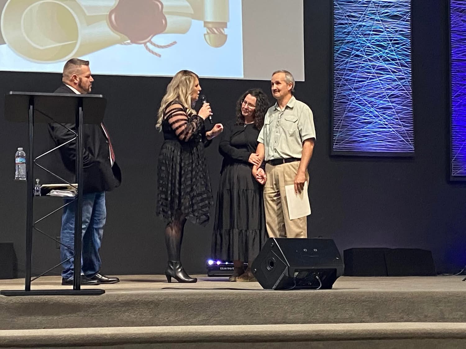 Angela Stress praying over a Pursuant School of Ministry student during commissioning