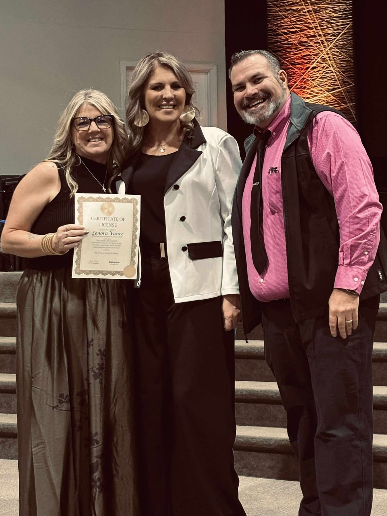Angela and Eddie Stress presenting a ministry license