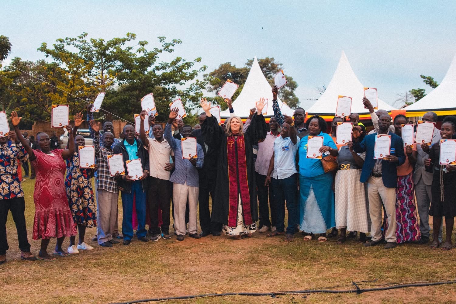 Angela Stress and Pursuant School of Ministry graduates holding their certificates